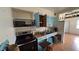 Classic kitchen features wood countertops, open shelving, and stainless steel appliances at 2410 38Th N Ave, St Petersburg, FL 33713
