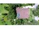Aerial view of the house showing the brown roof, green trees around, and a private pool at 2504 Oak Landing Dr, Brandon, FL 33511