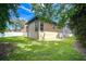 The spacious backyard is adjacent to the screened pool and has lush landscaping at 2504 Oak Landing Dr, Brandon, FL 33511