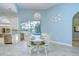 Eat in kitchen area with white wooden dining table and pool views at 2504 Oak Landing Dr, Brandon, FL 33511