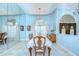 Bright dining room with large mirror, chandelier, and elegant furnishings, perfect for hosting formal dinners at 2504 Oak Landing Dr, Brandon, FL 33511