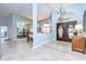 Light and airy foyer showcases soaring ceilings and an adjacent dining room with a mirrored wall at 2504 Oak Landing Dr, Brandon, FL 33511