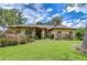 Beautiful single-Gathering home showcasing an expansive lawn, lovely landscaping, and a welcoming entrance at 2504 Oak Landing Dr, Brandon, FL 33511