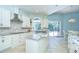 Well-lit kitchen with stainless steel appliances and access to the outdoor pool area at 2504 Oak Landing Dr, Brandon, FL 33511