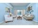 Inviting living room featuring a plush sofa, comfortable armchairs, and stylish decor with natural light at 2504 Oak Landing Dr, Brandon, FL 33511