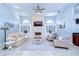 Bright living room with stone fireplace, built-in cabinets, and neutral decor at 2504 Oak Landing Dr, Brandon, FL 33511