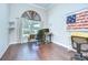 Spacious office with hardwood floors, a large window, and patriotic themed decor at 2504 Oak Landing Dr, Brandon, FL 33511