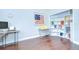 Bright office with hard wood flooring and patriotic themed decorations and corner shelving at 2504 Oak Landing Dr, Brandon, FL 33511