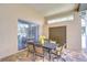 A covered patio features an outdoor dining set and sliding doors for seamless indoor-outdoor living at 2504 Oak Landing Dr, Brandon, FL 33511