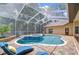 A clear view of an enclosed private pool with a lounge chair at 2504 Oak Landing Dr, Brandon, FL 33511