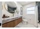 Modern bathroom features decorative round mirror, a sleek vanity, and upscale finishes at 3197 Walnut Ne St, St Petersburg, FL 33704