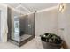 A luxurious bathroom with a glass shower, a black soaking tub, and modern fixtures at 3197 Walnut Ne St, St Petersburg, FL 33704