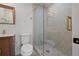 Contemporary bathroom featuring modern shower, wood vanity, and decorative tile at 3197 Walnut Ne St, St Petersburg, FL 33704