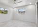 Bright bedroom featuring a ceiling fan, neutral paint, and natural light at 3197 Walnut Ne St, St Petersburg, FL 33704