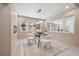 Well-lit dining room boasts a fireplace and an inviting view of the backyard at 3197 Walnut Ne St, St Petersburg, FL 33704