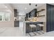 Modern kitchen featuring stylish bar seating, marble countertops, and sleek appliances at 3197 Walnut Ne St, St Petersburg, FL 33704