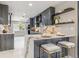 Well-appointed kitchen with a breakfast bar, stainless steel appliances, and marble countertops at 3197 Walnut Ne St, St Petersburg, FL 33704