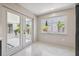 Inviting living area with sliding doors, a large window, and natural light at 3197 Walnut Ne St, St Petersburg, FL 33704