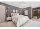 Comfortable and modern main bedroom with neutral color palette, ceiling fan, and unique wall decor at 3197 Walnut Ne St, St Petersburg, FL 33704