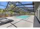 Relax and unwind in this screened-in pool area with comfortable lounge chairs at 3197 Walnut Ne St, St Petersburg, FL 33704