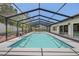 Enjoy a swim in this large screened-in pool, perfect for relaxation and entertainment at 3197 Walnut Ne St, St Petersburg, FL 33704