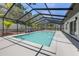The backyard boasts a screened-in pool with manicured landscaping at 3197 Walnut Ne St, St Petersburg, FL 33704