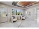 Cozy seating area with modern decor, unique ceiling design, and ample natural light at 3197 Walnut Ne St, St Petersburg, FL 33704