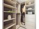Organized walk-in closet with custom shelving, hanging rods, and a minimalist aesthetic at 3197 Walnut Ne St, St Petersburg, FL 33704