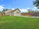 This backyard has a garage, shed, well-kept grass, and a driveway at 3327 25Th N St, St Petersburg, FL 33713