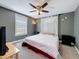 Cozy bedroom with a ceiling fan, window, and neutral color scheme for relaxation at 3327 25Th N St, St Petersburg, FL 33713