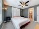 Bedroom with ceiling fan, gray walls, carpet and attached bathroom at 3327 25Th N St, St Petersburg, FL 33713