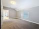 Spacious bedroom with neutral carpet, natural light and access to other rooms at 3327 25Th N St, St Petersburg, FL 33713