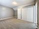 Bedroom with gray walls and carpet with closet and access to the rest of the home at 3327 25Th N St, St Petersburg, FL 33713