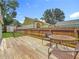 View of wood deck with table and chairs, and wood fence in backyard at 3327 25Th N St, St Petersburg, FL 33713