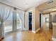 Hallway with exterior french doors and storage closet; view to kitchen at 3327 25Th N St, St Petersburg, FL 33713