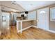 Modern kitchen with stainless steel appliances, white cabinets, and eat-in counter space at 3327 25Th N St, St Petersburg, FL 33713