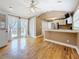 Open kitchen with white cabinets, stainless appliances, and French doors leading to the outdoor patio at 3327 25Th N St, St Petersburg, FL 33713