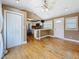 Living area with vaulted ceilings, ceiling fan, view of the kitchen and exterior access at 3327 25Th N St, St Petersburg, FL 33713