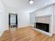 Bright living room featuring wood floors, a fireplace, and recessed lighting at 3327 25Th N St, St Petersburg, FL 33713