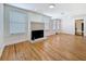 Spacious living room featuring hardwood floors, a fireplace, and abundant natural light at 3327 25Th N St, St Petersburg, FL 33713