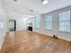 Bright and spacious living room featuring hardwood floors, a fireplace, and neutral decor at 3327 25Th N St, St Petersburg, FL 33713