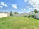 Large backyard featuring a vinyl fence and garden at 34033 Jasper Stone Dr, Wesley Chapel, FL 33543