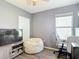 Bedroom featuring a neutral color scheme, a comfy beanbag chair, and a workspace at 34033 Jasper Stone Dr, Wesley Chapel, FL 33543