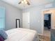 Bright bedroom with a view to another room, neutral decor, and a comfortable bed at 34033 Jasper Stone Dr, Wesley Chapel, FL 33543
