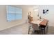 Bright dining area featuring modern table and seating, with views from a window and the entry at 34033 Jasper Stone Dr, Wesley Chapel, FL 33543