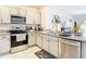 Well-appointed kitchen featuring granite countertops, stainless steel appliances, and ample cabinet space at 34033 Jasper Stone Dr, Wesley Chapel, FL 33543