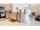 Modern kitchen featuring granite countertops, stainless steel appliances, and an open layout to the living area at 34033 Jasper Stone Dr, Wesley Chapel, FL 33543