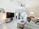 Well-lit living room featuring neutral tones and tile flooring at 34033 Jasper Stone Dr, Wesley Chapel, FL 33543