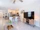 Bright, open-concept living room flows into the kitchen with a breakfast bar and modern appliances at 34033 Jasper Stone Dr, Wesley Chapel, FL 33543