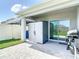 Covered patio boasts a storage shed, BBQ grill, and sliding glass door at 34033 Jasper Stone Dr, Wesley Chapel, FL 33543